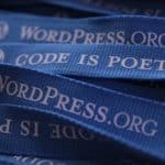 nastri con scritta "code is poetry" e logo WordPress